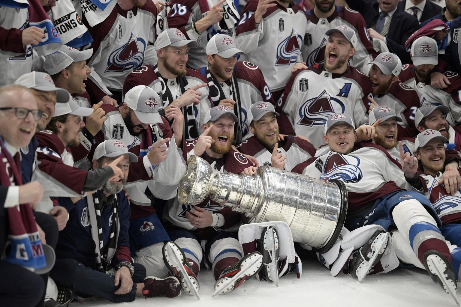 The Colorado Avalanche pose with the Stanley Cup after defeating the Tampa Bay Lightning 2-1 in Game 6 of the NHL hockey Stanley Cup Finals on Sunday, June 26, 2022, in Tampa, Fla. (AP Photo/Phelan Eb ...