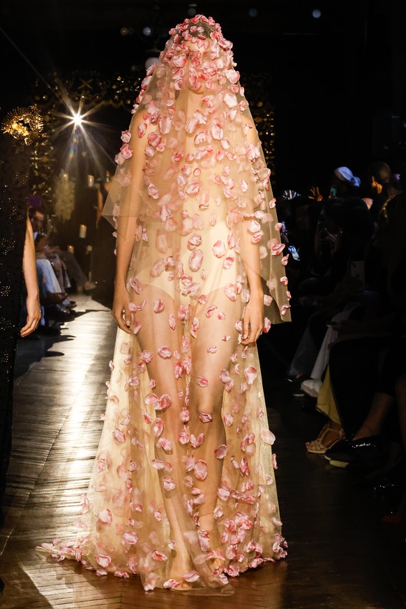 epa12225237 A model presents a creation from the Haute Couture Autumn/Winter 2025/2026 collection by Spanish designer Juana Martin during Paris Fashion Week, in Paris, France, 08 July 2025. The presen ...