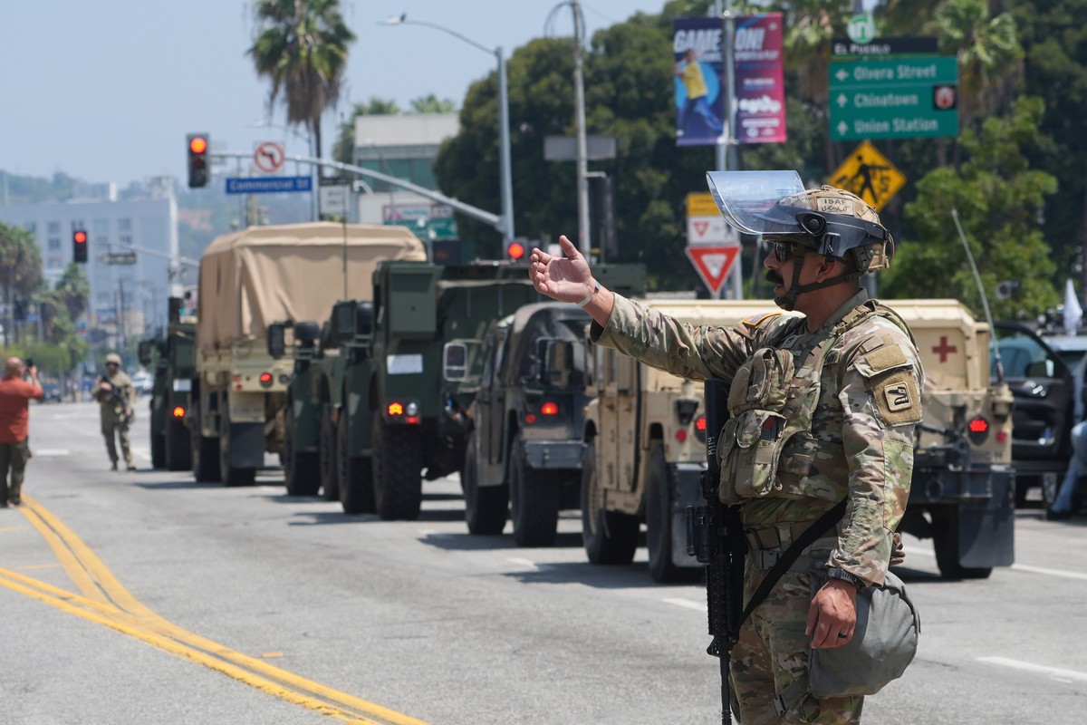 U.S. National Guard direct Tuesday, June 10, 2025, in Los Angeles. (AP Photo Damian Dovarganes)
Immigration Raids Los Angeles