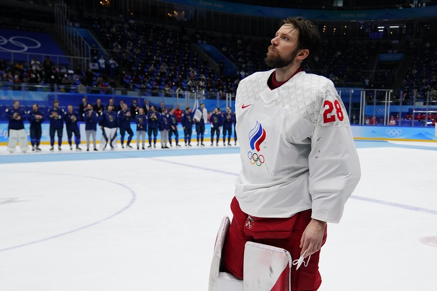 Russian Olympic Committee goalkeeper Ivan Fedotov (28) skates across the ice to receive his silver medal after Finland defeated Russian Olympic Committee in the men&#039;s gold medal hockey game at th ...