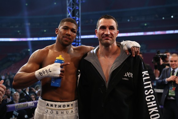 British boxer Anthony Joshua, left, greets Ukrainian boxer Wladimir Klitschko after winning their fight for Joshua&#039;s IBF and the vacant WBA Super World and IBO heavyweight titles, at Wembley Stad ...