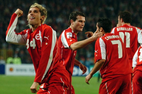 From left to right: Swiss Valon Behrami, Alex Frei, Ricardo Cabanas and Marco Streller jubilate after the second goal for their team during the FIFA 2006 qualifying play-off second leg soccer match be ...
