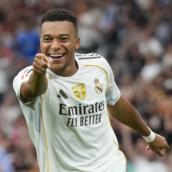 Real Madrid&#039;s Kylian Mbappe celebrates after scoring his side&#039;s second goal during the Spanish La Liga soccer match between Real Madrid and Espanyol at the Santiago Bernabeu stadium in Madri ...