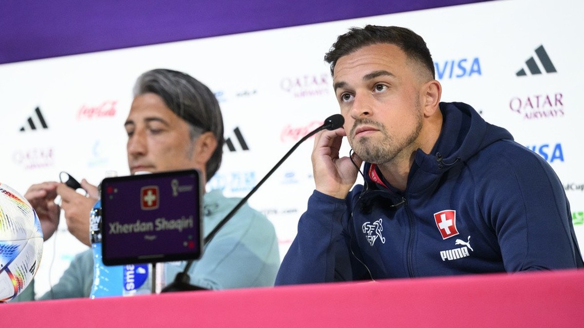 Switzerland's head coach Murat Yakin, left, and Switzerland's midfielder Xherdan Shaqiri, right, during a press conference of the Swiss national soccer team on the eve of the FIFA World Cup  ...