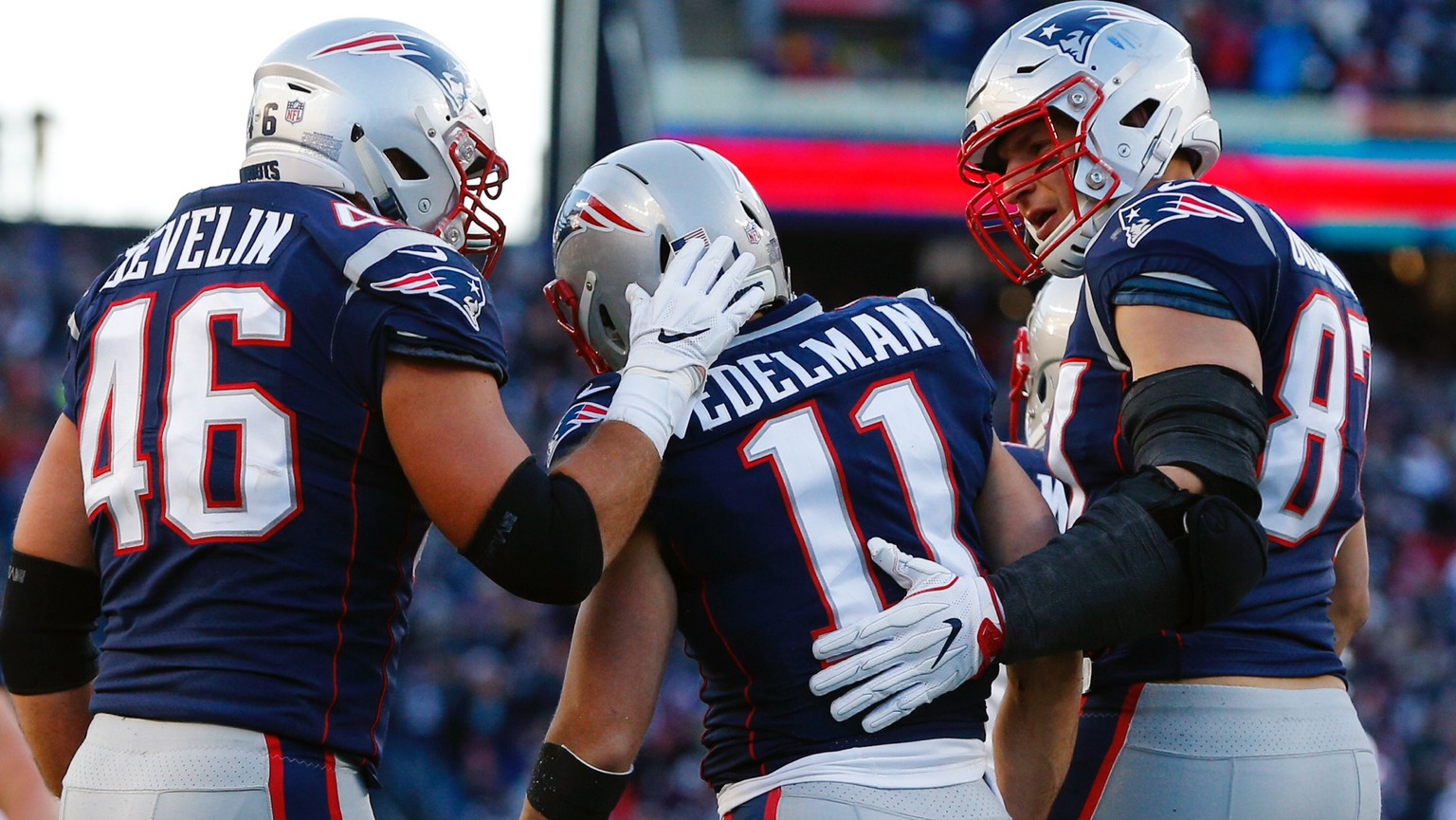 epa07247052 New England Patriots wide receiver Julian Edelman (C) is congratulated by teammates New England Patriots fullback James Develin (L) and New England Patriots tight end Rob Gronkowski (R) af ...