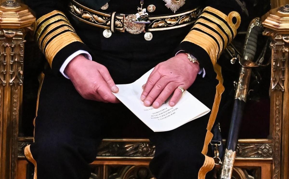 LONDON, ENGLAND - MAY 10: Prince Charles, Prince of Wales holds the Queen's Speech in his hands after reading it in the House of Lords Chamber, during the State Opening of Parliament in the House ...