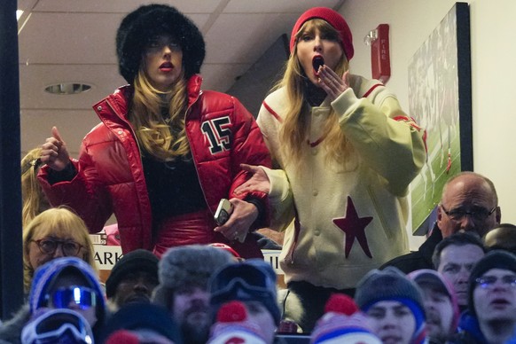 Taylor Swift, right, and Brittany Mahomes react during the third quarter of an NFL AFC division playoff football game between the Buffalo Bills and the Kansas City Chiefs, Sunday, Jan. 21, 2024, in Or ...
