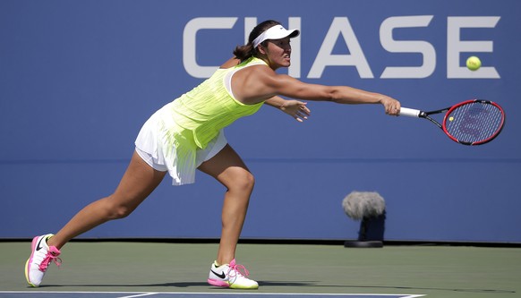 epa05514351 Samantha Crawford of the US hits a return to Belinda Bencic of Switzerland during their match on the first day of the US Open Tennis Championship at the USTA National Tennis Center in Flus ...