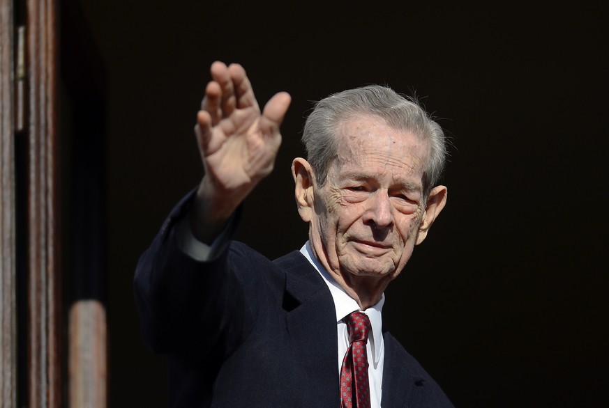 FILE - In this Friday, Nov. 8, 2013, file photo, former Romanian King Michael waves to supporters during an appearance for his name day at his residence, the Elisabeta Palace in Bucharest, Romania. Ro ...