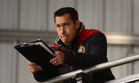 Ottawa Senators head coach Guy Boucher watches his team during NHL hockey training camp in Ottawa, Friday, Sept. 23, 2016. (Sean Kilpatrick/The Canadian Press via AP)