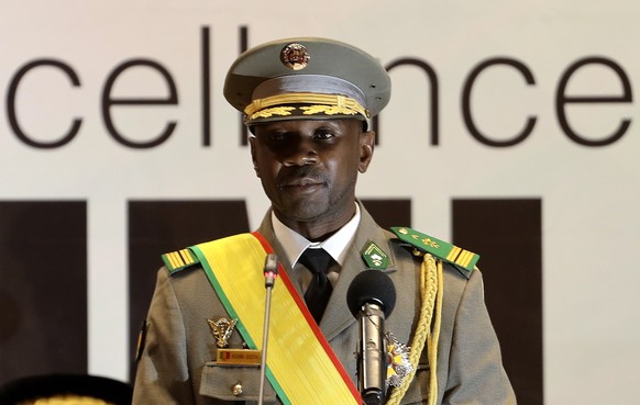 epa09253165 Mali transitional President Colonel Assimi Goita during his swearing-in ceremony in Bamako, Mali, 07 June 2021. Assimi Goita was sworn in during a ceremony in the capital and has set Febru ...