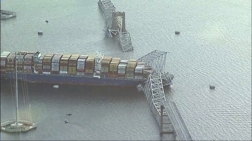 Parts of the Francis Scott Key Bridge remain after a container ship collided with a support Tuesday, March 26, 2024 in Baltimore. The major bridge in Baltimore snapped and collapsed after a container  ...