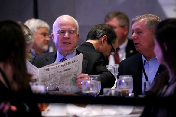 U.S. Senator John McCain (R-AZ) (L) and Senator Lindsey Graham (R-SC) (R) chat before President Donald Trump arrives to speak at a congressional Republican retreat in Philadelphia, U.S. January 26, 20 ...