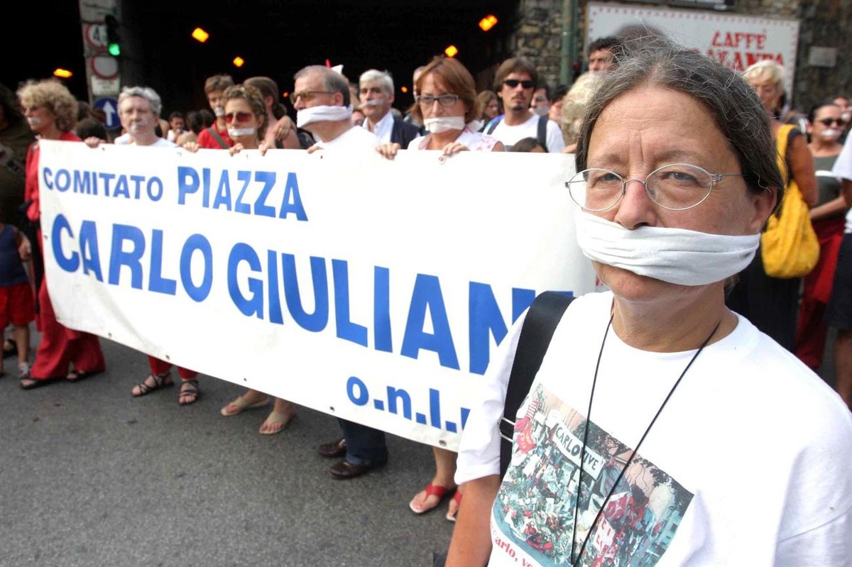 The mother of Carlo Giuliani, Heidi (R), attends the "silent rally" organized downtown Genoa on Sunday, 20 July 2003 to commemorate the 2nd anniversary of the death of the Italian youth who  ...