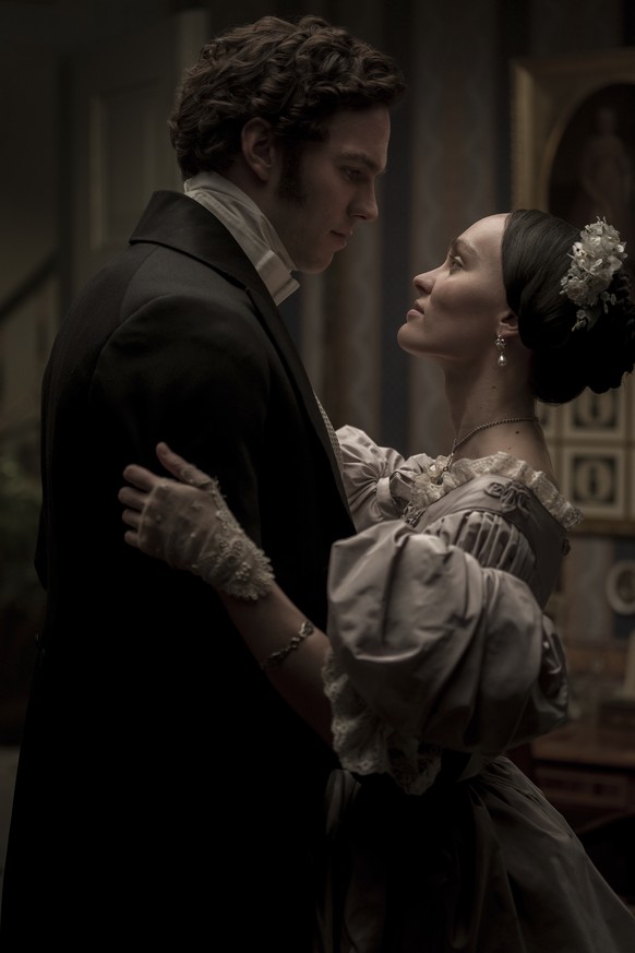 This imaged released by Focus Features shows Nicholas Hoult, left, and Lily-Rose Depp in a scene from &quot;Nosferatu&quot;. (Focus Features via AP)