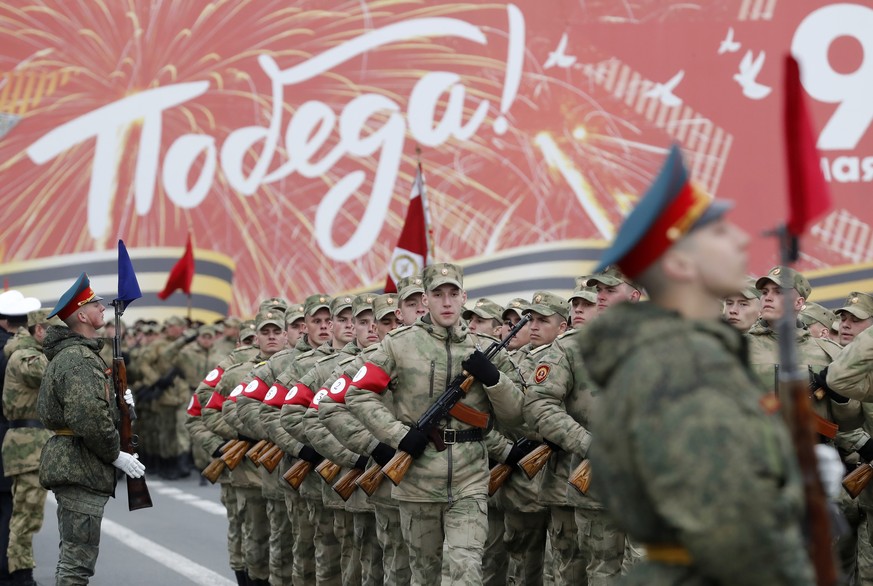 epa09928530 Russian service members march during a rehearsal for the Victory Day parade in St. Petersburg, Russia, 05 May 2022. The military parade marking the 77th anniversary of the victory over Naz ...