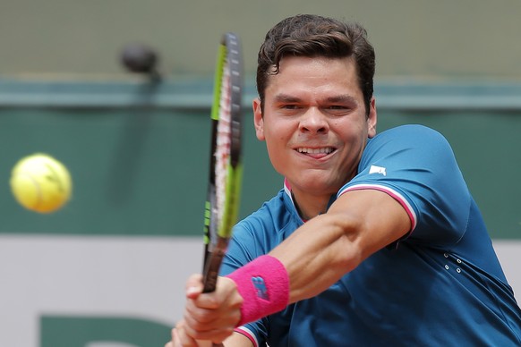 Canada&#039;s Milos Raonic plays a shot against Spain&#039;s Guillermo Garcia-Lopez during their third round match of the French Open tennis tournament at the Roland Garros stadium, in Paris, France.  ...