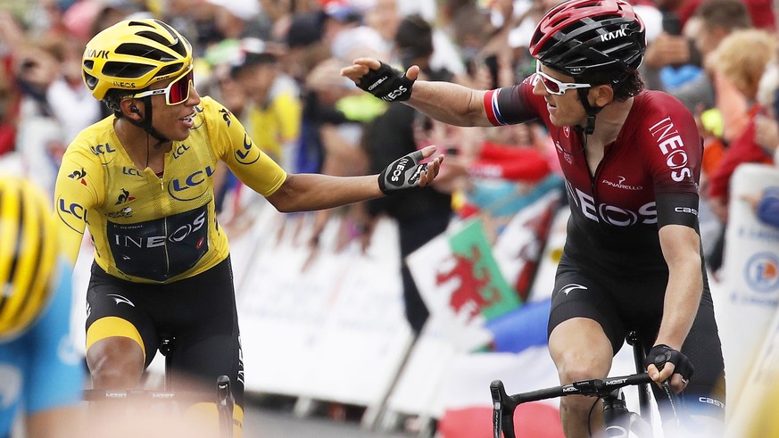 epa07744408 Colombia&#039;s Egan Bernal (L) of Team Ineos is congratulated by his British teammate Geraint Thomas (R) after retaining the overall leader&#039;s yellow jersey in the 20th stage of the 1 ...