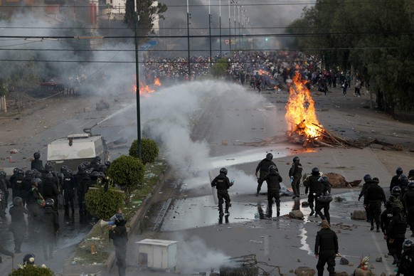 Police block the highway that connects Sacaba and Cochabamba to prevent backers of former President Evo Morales from reaching Cochabamba, Bolivia, Saturday, Nov. 16, 2019. Officials now say at least e ...