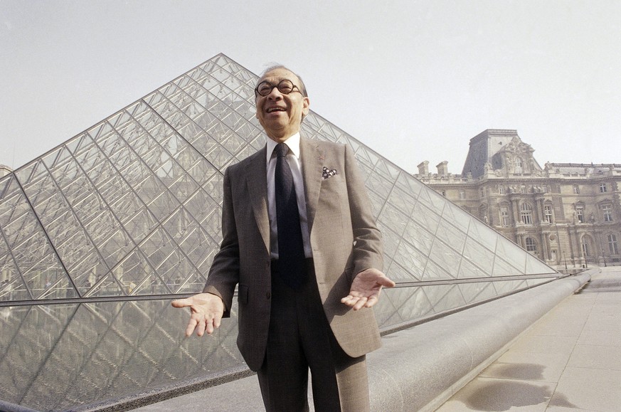 FILE - In this March 29, 1989, file photo, Chinese-American architect I.M. Pei laughs while posing for a portrait in front of the Louvre glass pyramid, which he designed, in the museum&#039;s Napoleon ...