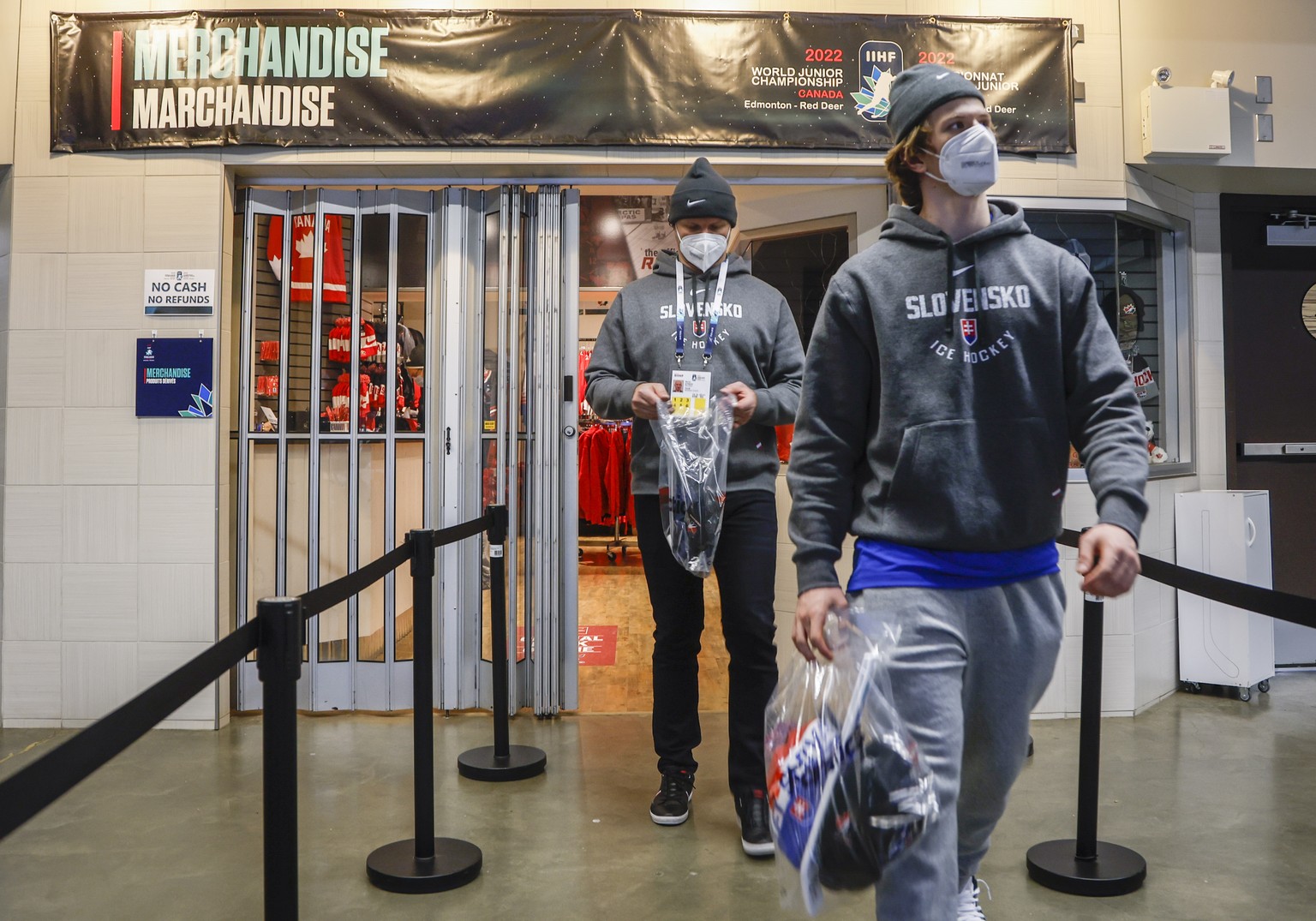 Players from the Slovakian team purchase souvenirs after the remainder of IIHF World Junior Hockey Championship was cancelled due to -cv1- on Wednesday, Dec. 29, 2021, in Red Deer, Alberta. (Jeff McIn ...