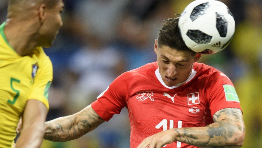 Switzerland&#039;s midfielder Steven Zuber, right, scores the goal to 1 :1 next to Brazil&#039;s midfielder Carlos Henrique Casimiro, left, during the FIFA soccer World Cup 2018 group E match between  ...