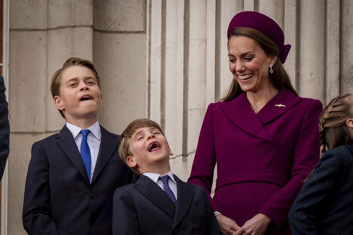 From left, Prince George, Prince Louis and Kate Princess of Wales on the balcony of Buckingham Palace to view the fly past featuring the Royal Air Force's Red Arrows after a military procession m ...