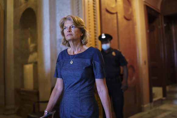 Sen. Lisa Murkowski, R-Alaska, one of the bipartisan infrastructure negotiators, leaves the chamber as the Senate advances to formally begin debate on a roughly $1 trillion infrastructure plan, a proc ...