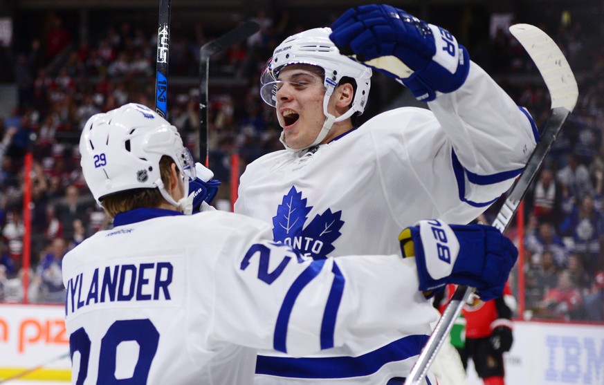 Toronto Maple Leafs center Auston Matthews, right, celebrates a first period goal against the Ottawa Senators with teammate William Nylander during an NHL hockey game Wednesday, Oct. 12, 2016, in Otta ...