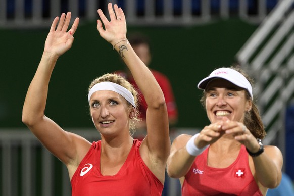 epa05479172 Timea Bacsinszky, left, and Martina Hingis, right, of Switzerland celebrate after winning the women&#039;s semi-final doubles match against Andrea Hlavackova and Lucie Hradecka from Czech  ...