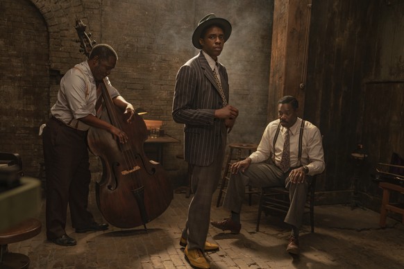 This image released by Netflix shows Michael Potts, from left, Chadwick Boseman and Colman Domingo in "Ma Rainey's Black Bottom." Boseman received two posthumous nominations from the Sc ...