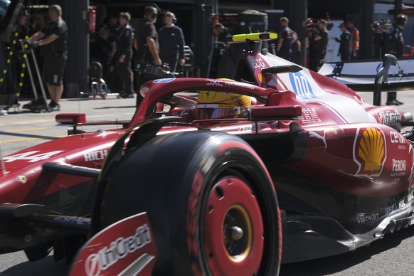 Ferrari driver Lewis Hamilton of Britain steers his car during the qualifying session ahead of the Formula One Dutch Grand Prix at the Zandvoort racetrack in Zandvoort, Netherlands, Saturday, Aug. 30, ...