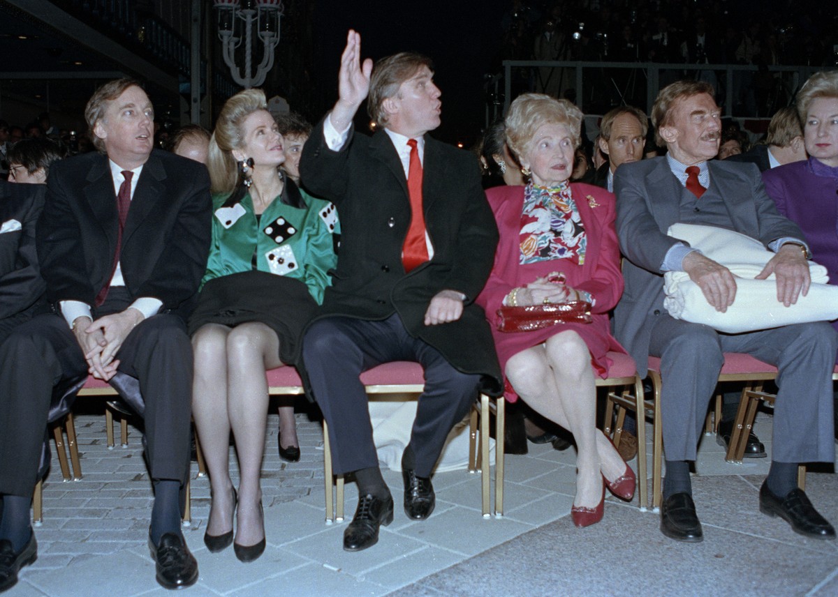 FILE - In this April 5, 1990, file photo, Donald Trump waves to staff members of the Trump Taj Mahal Casino Resort as they cheer him on before the grand opening ceremonies in Atlantic City, N.J. Trump ...