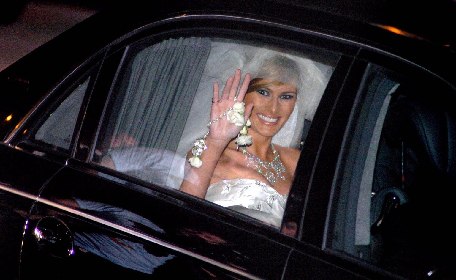 Syndication: Palm Beach Daily News 050122 PBDN photo by Jeffrey Langlois Melania Trump waves after marrying Donald Trump at The Episcopal Church of Bethesda by-the-Sea Saturday night. Trump wedding OR ...