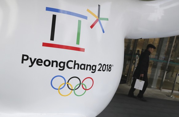 FILE - In this Thursday, Jan. 4, 2018, file photo, the official emblem of the 2018 Pyeongchang Olympic Winter Games is seen in downtown Seoul, South Korea. With little time to spare, North and South K ...