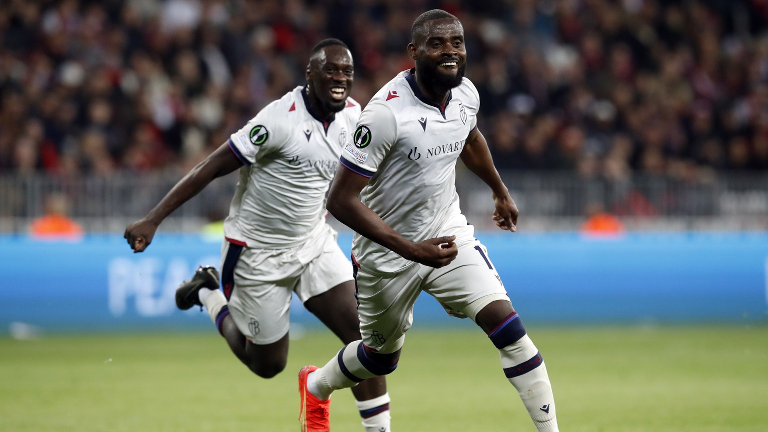 epa10582783 Kasim Adams Nuhu (R) of Basel celebrates after scoring the 2-1 lead during the UEFA Europa Conference League quarter final, 2nd leg match between OGC Nice and FC Basel in Nice, France, 20  ...
