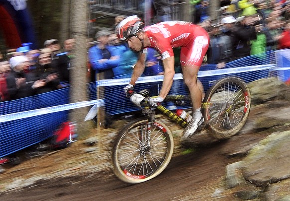 Swiss Nino Schurter pedals to his second place in menÅ½s mountain biking World Cup race in Nove Mesto na Morave, Czech Republic, Sunday, May 24, 2015. (Lubos Pavlicek/CTK via AP) SLOVAKIA OUT