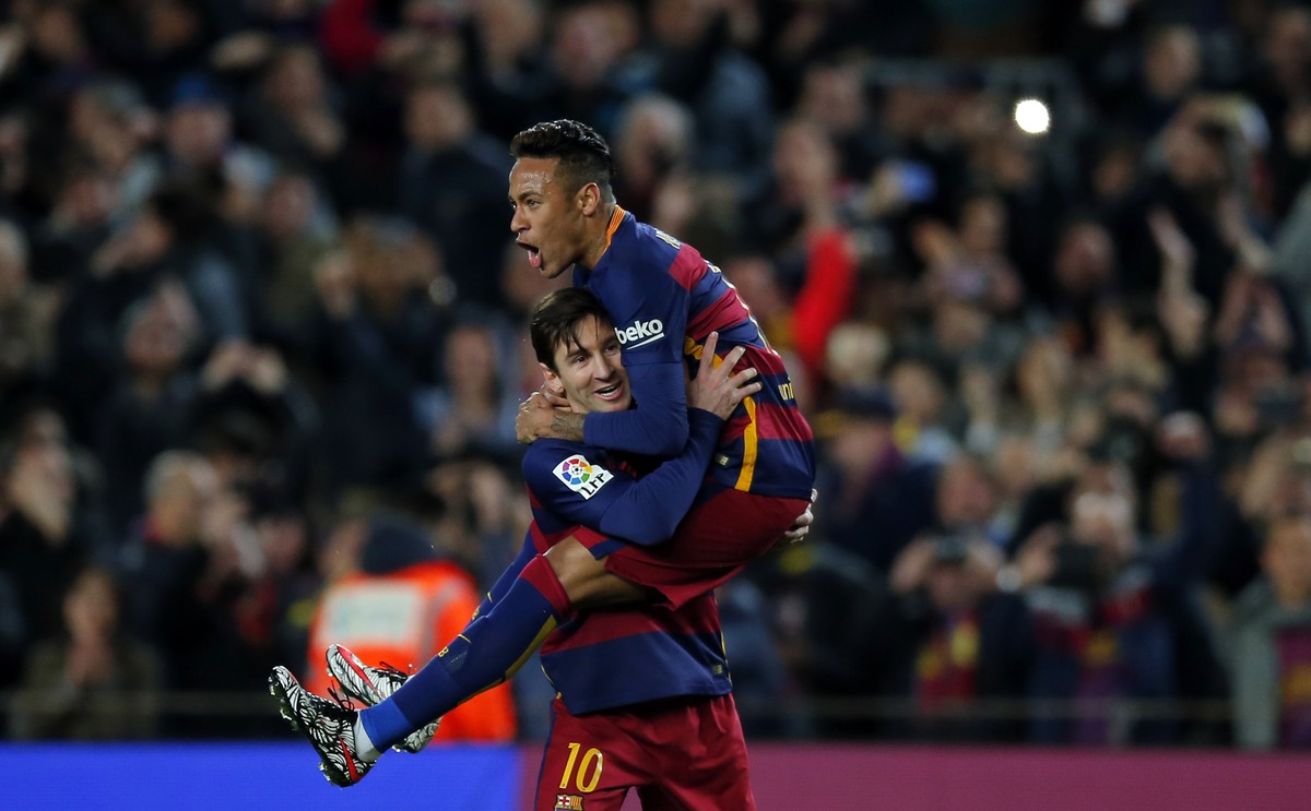FILE - In this Feb. 28, 2016, file photo, FC Barcelona's Lionel Messi, left, celebrates after scoring against Sevilla with his teammate Neymar during a Spanish La Liga soccer match at the Camp No ...