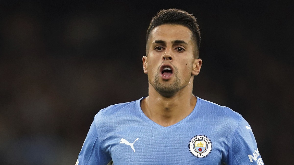 Manchester City's Joao Cancelo celebrates scoring during the Champions League Group A soccer match between Manchester City and RB Leipzig at the Etihad Stadium, Manchester, England, Wednesday Sep ...