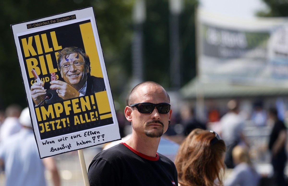 epa08426221 A view of a banner reading 'Kill Bill Covid 19 Vaccinate now all' during a demonstration of the initiative 'Lateral thinking' in Stuttgart, Germany, 16 May 2020. A seri ...