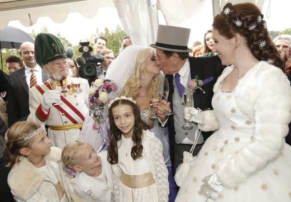 Here is a wedding photo of the two.  The costumes of the guests refer to the TV show 