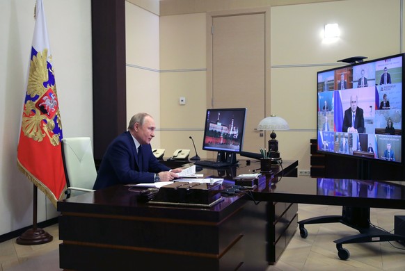 Russian President Vladimir Putin attends a cabinet meeting via videoconference at the Novo-Ogaryovo residence outside Moscow, Russia, Wednesday, March 23, 2022. (Mikhail Klimentyev, Sputnik, Kremlin P ...