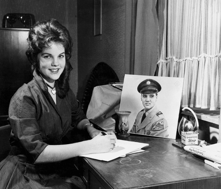 2nd March 1960: Wiesbaden, West Germany. 16 yr old Priscilla Beaulieu, daughter of a United States air force captain from Austin, Texas, writes a letter to her friend, Elvis Presley. She has been the  ...