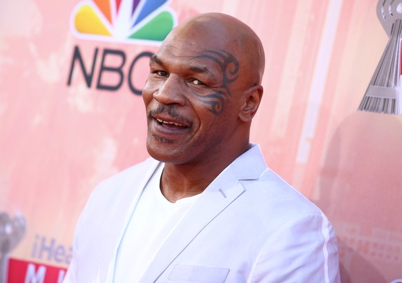 Mike Tyson arrives at the iHeartRadio Music Awards at The Shrine Auditorium on Sunday, March 29, 2015, in Los Angeles. (Photo by John Salangsang/Invision/AP)